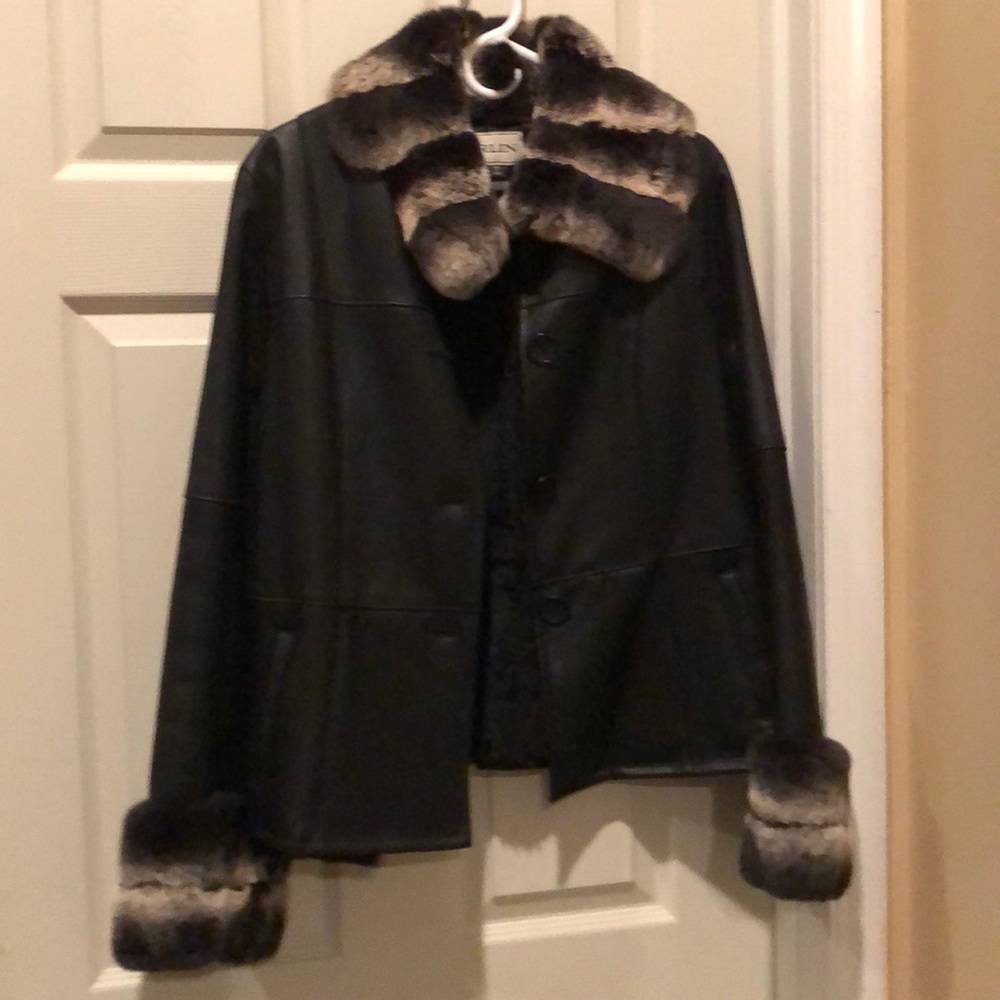 Black Leather coat lined with fur on the inside
